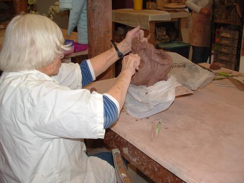 Mimi working on a sculpture